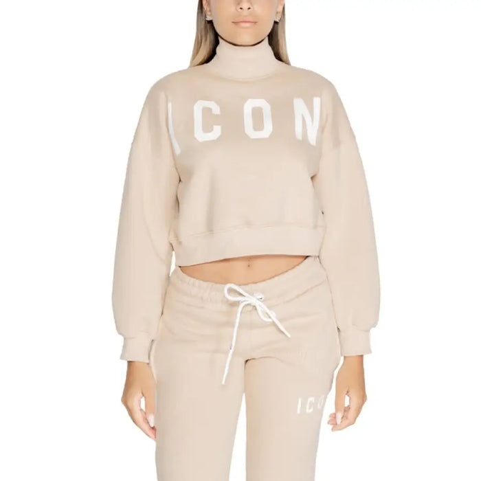 Cropped beige turtleneck sweater with ICON text across the chest for women