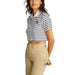 Cropped striped polo shirt paired with khaki pants from Tommy Hilfiger Women’s collection