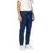 Dark blue Calvin Klein men’s jeans with straight-leg fit, zip and button closure