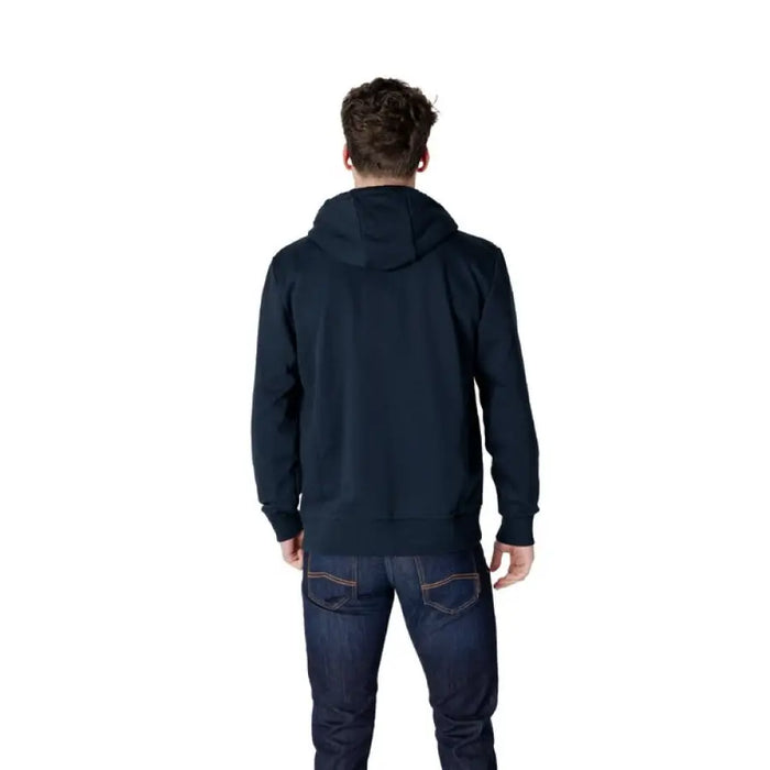 Dark blue Colmar Originals Men’s zip hooded sweatshirt paired with jeans