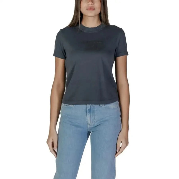 Dark gray crew neck t-shirt with light blue jeans in Calvin Klein Jeans Women’s collection