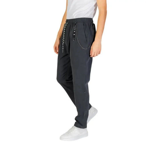 Dark gray Gianni Lupo jogger pants featuring chain detail and elastic waistband