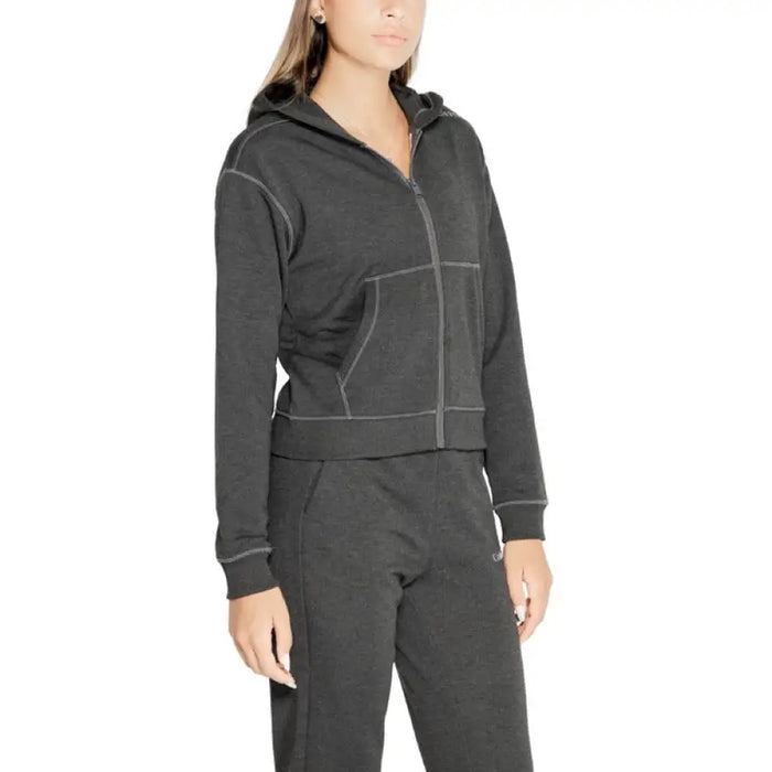 Dark gray zip-up hoodie worn by a model showcasing Calvin Klein Sport Women Sweatshirts