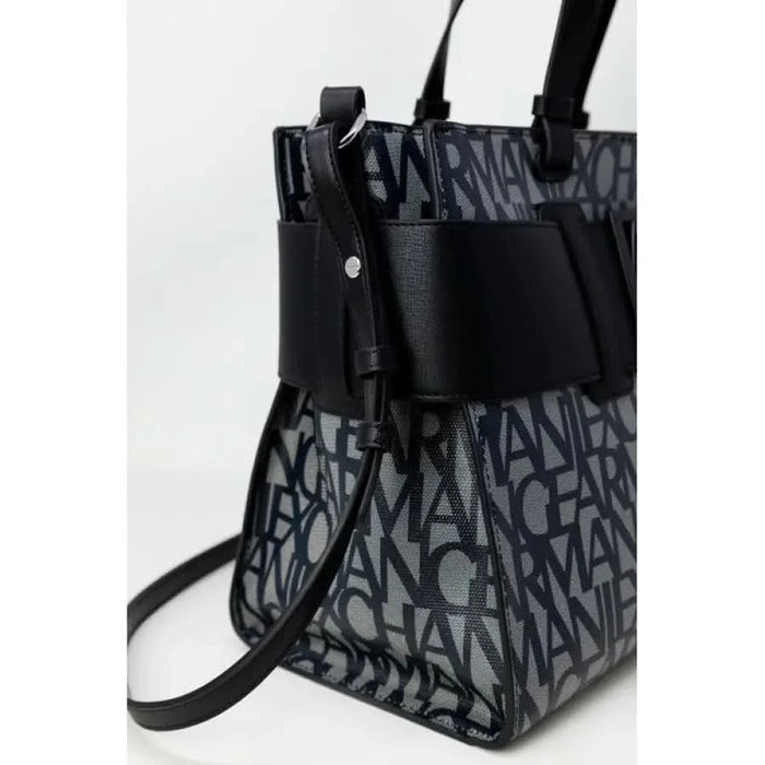 Designer handbag featuring repeating text pattern and black leather trim by Armani Exchange