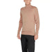 Dusty pink turtleneck sweater showcased on a model from Calvin Klein Men Knitwear