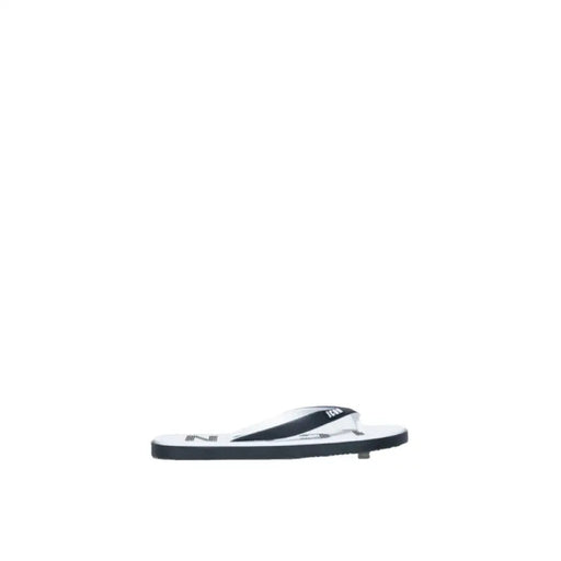 Icon Men Slippers featuring a flip-flop sandal with a black sole and white strap