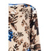 Floral patterned fabric featuring brown and blue flowers on beige for Rinascimento blouse