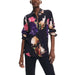 Floral print long sleeve shirt by Desigual on a dark background