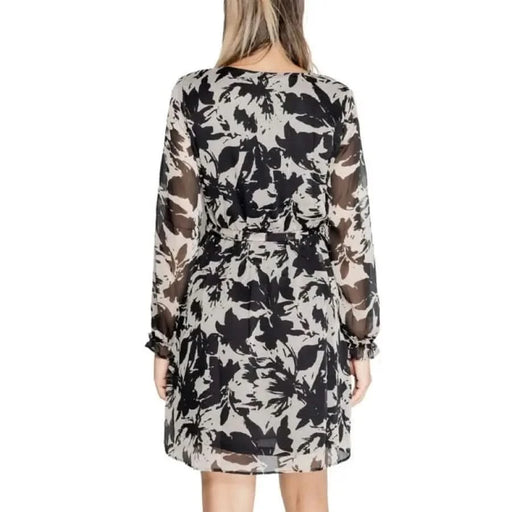 Floral print dress with sheer long sleeves in black and white by Jacqueline De Yong