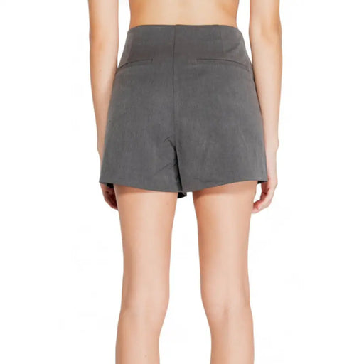 Gray high-waisted shorts worn by a model from behind for Only Women Short collection