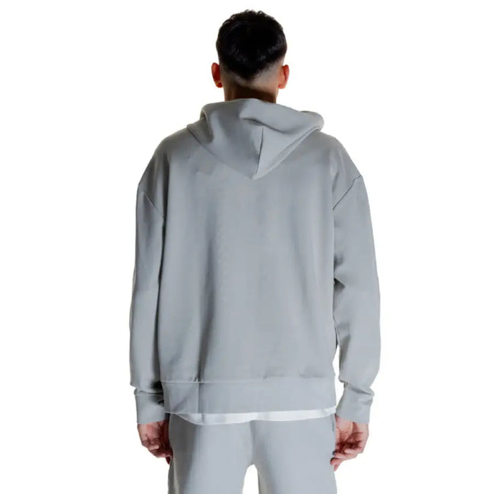 Gray hooded sweatshirt rear view worn by a person, Calvin Klein Men Sweatshirts product