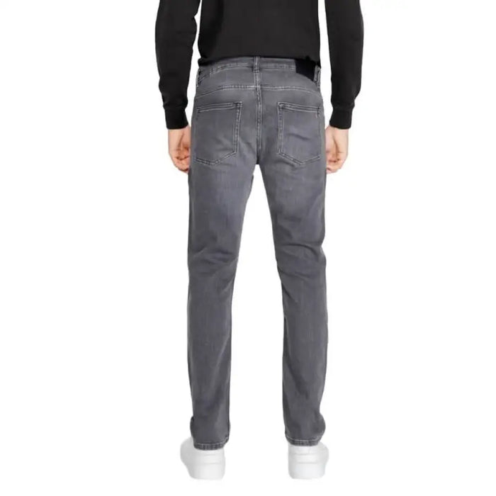 Gray straight-leg jeans by Boss displayed from behind for men’s fashion