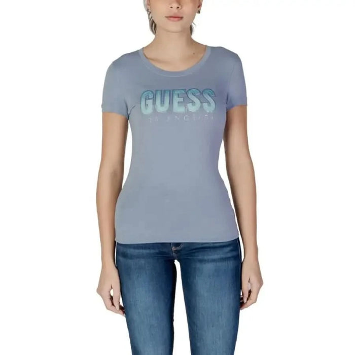 Gray t-shirt featuring metallic GUESS logo across the chest in stylish design