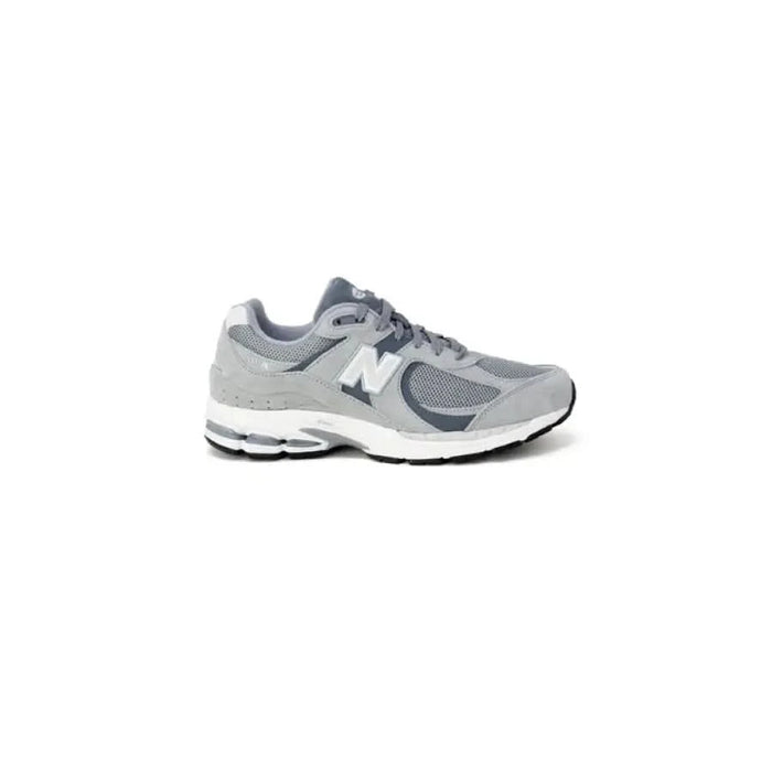 Gray and white New Balance Men Sneakers featuring a prominent N logo on the side