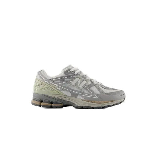 Gray and white New Balance Men Sneakers featuring a chunky sole and mesh detailing