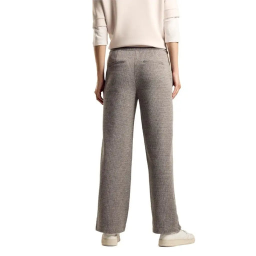 Gray wide-leg lounge pants worn by a person from the waist down by Street One