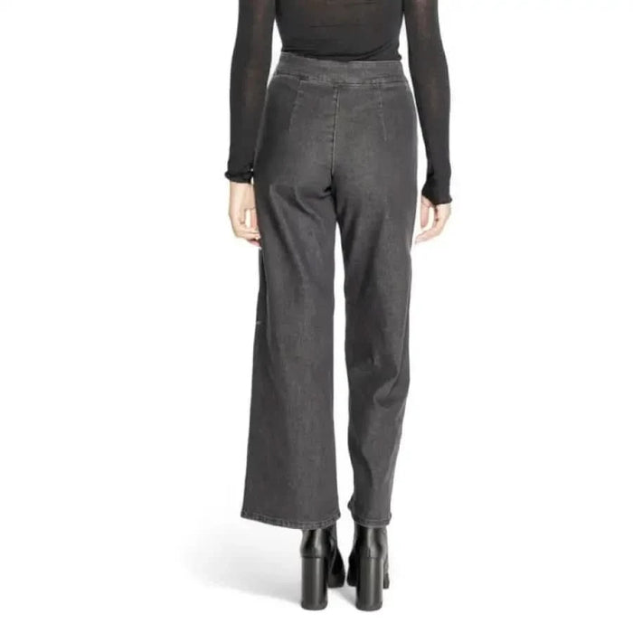 Gray wide-leg trousers viewed from behind, featured in Jacqueline De Yong Women Jeans