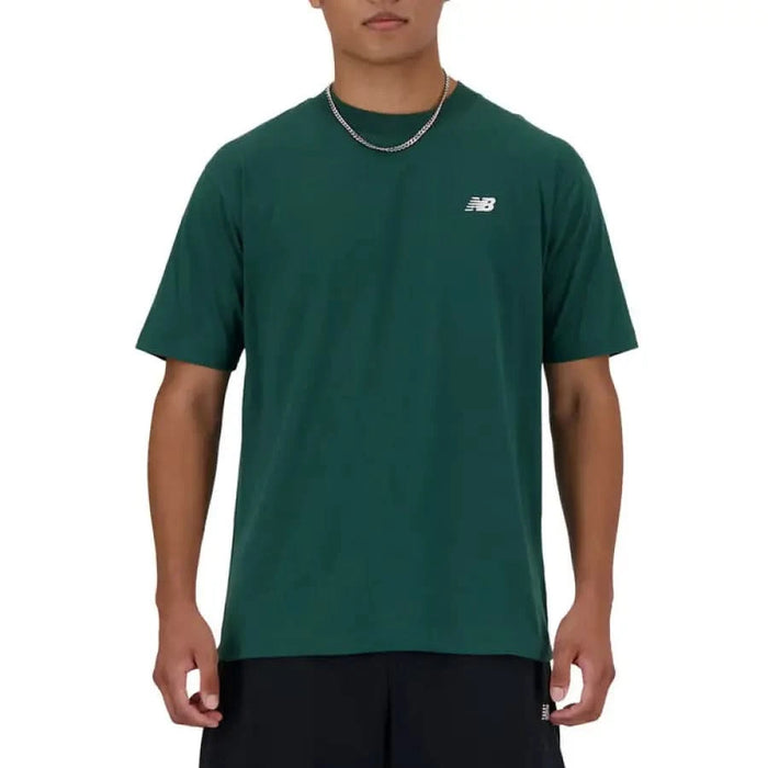 Person wearing a green New Balance Men T-Shirt by New Balance