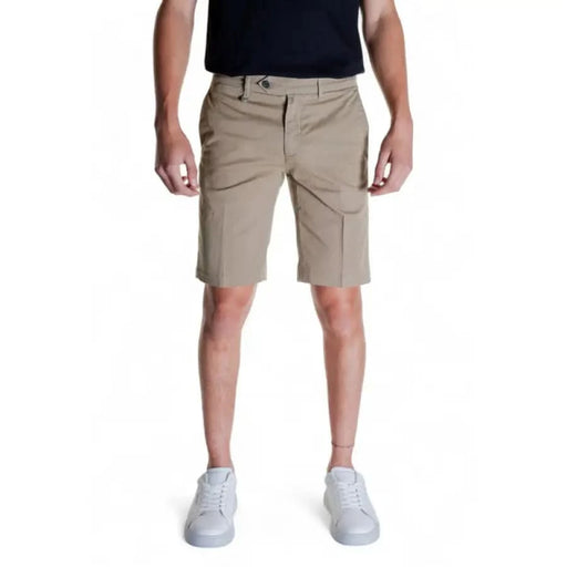 Khaki knee-length Antony Morato Men Shorts with side pockets worn by person in black shirt