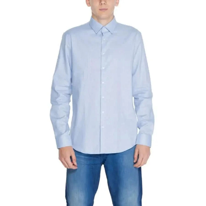 Calvin Klein Men Shirt - Light blue button-up dress shirt with blue jeans for a casual look