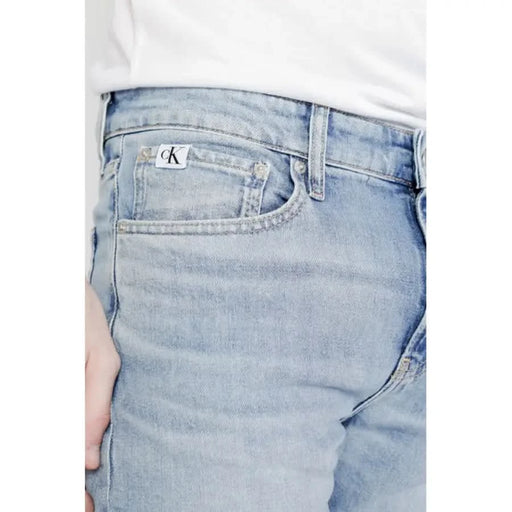 Light blue Calvin Klein denim jeans showcasing logo on pocket for men