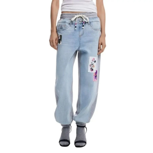 Light blue denim jogger pants with cartoon patches from Desigual Blue for women