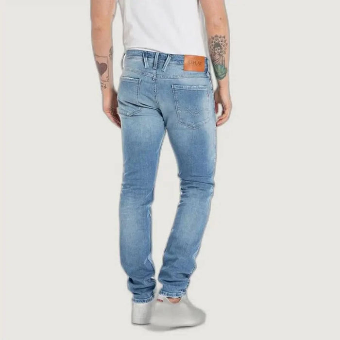 Light blue Replay Men Jeans showcased on a person with tattooed arms