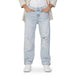 Light blue distressed Calvin Klein jeans featuring knee rips for a stylish look