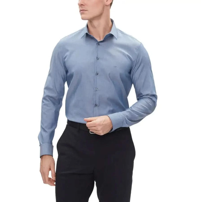 Calvin Klein Men Shirt Light Blue Dress Shirt Paired with Black Trousers Fashion Display