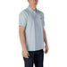 Light blue Lacoste Men’s Polo Shirt displayed on a neutral background