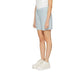 Vero Moda light blue women’s shorts paired with stylish white sneakers