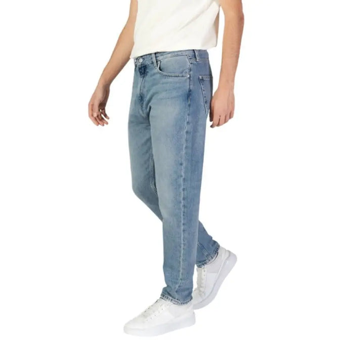 Light blue straight-leg denim jeans with classic five-pocket design by Calvin Klein