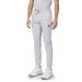 Le Coq Sportif Men’s light gray sweatpants with a logo on the thigh, paired with white sneakers