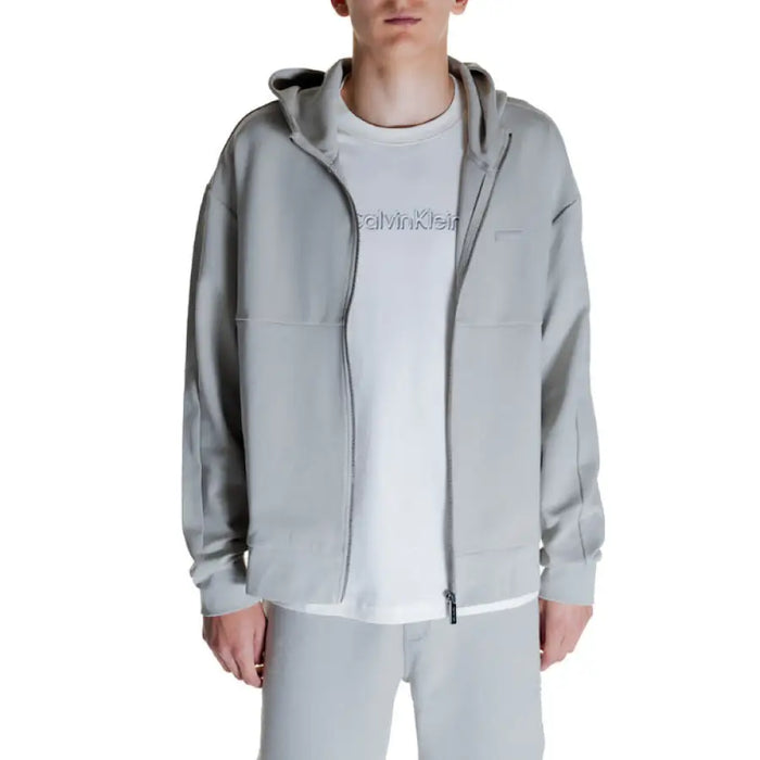 Light gray zip-up hoodie over white Calvin Klein t-shirt from Calvin Klein Men Sweatshirts