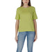 Lime green short-sleeved t-shirt with light blue jeans styled by B.young