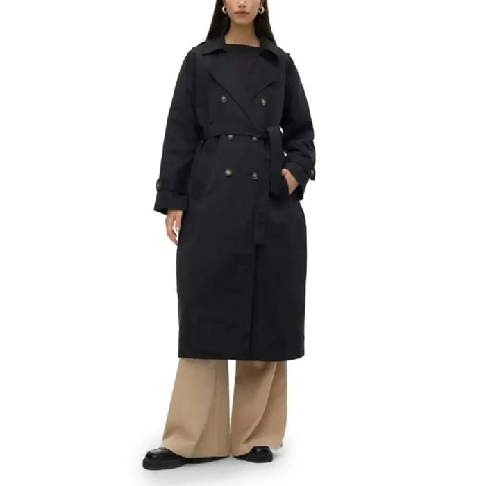 Vero Moda black double-breasted trench coat over beige wide-leg pants for women