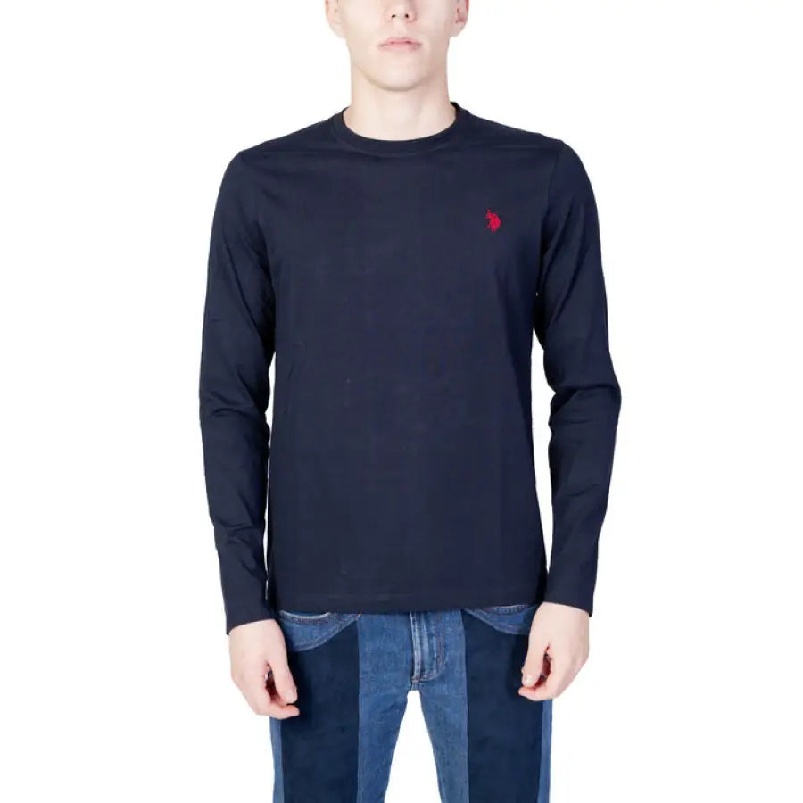 Man wearing black U.s. Polo Assn. long-sleeved shirt with red chest logo
