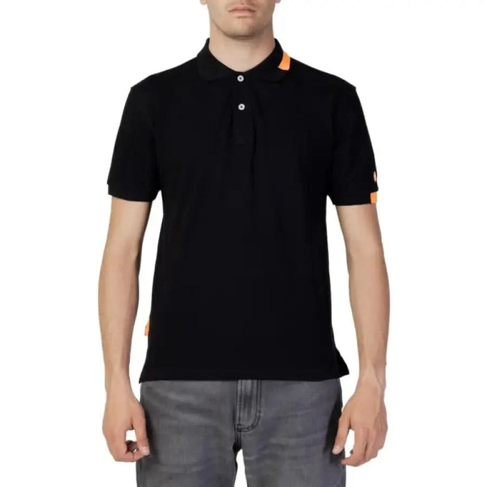 Man in Suns Men Polo, black with orange collar, showcasing urban city style clothing