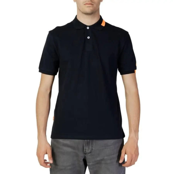 Man in Suns Men Polo showcasing urban city fashion, black shirt with orange collar