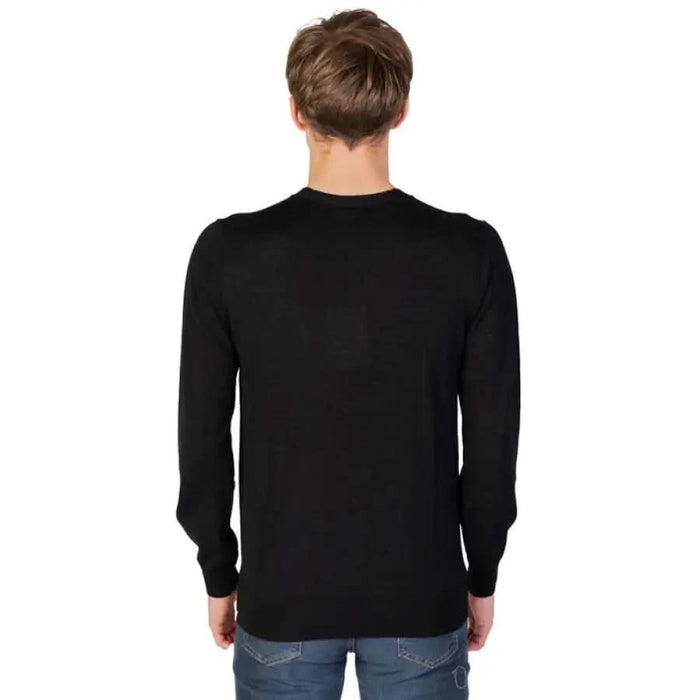 Man in black sweater and jeans from Liu Jo Men Knitwear collection by Liu Jo