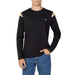 Man wearing Alviero Martini Prima Classe black sweatshirt with cut out shoulder