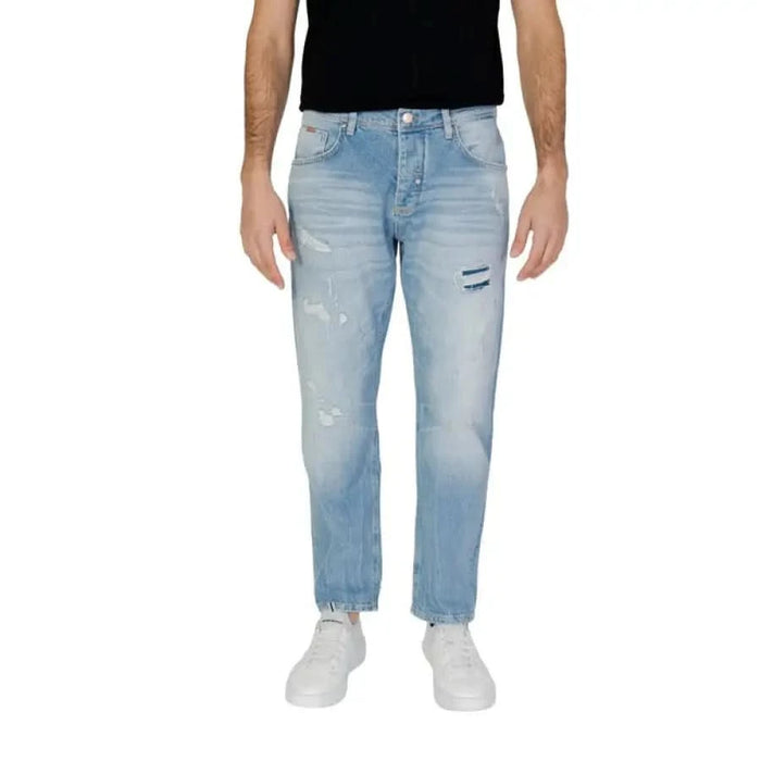 Man modeling Antony Morato jeans in a black T-shirt for Antony Morato Men Jeans product.