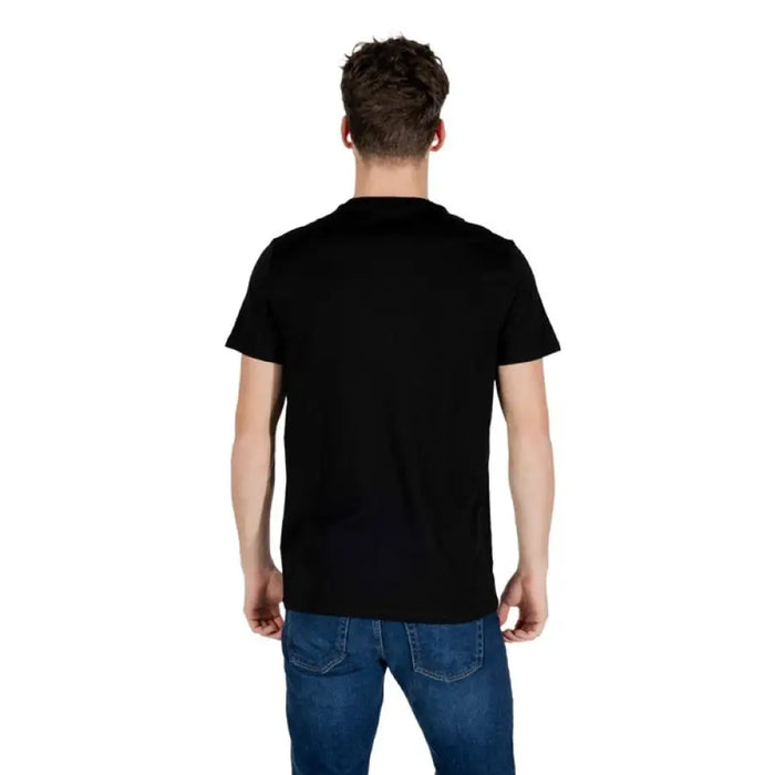 Man wearing Lacoste Black Short Round Neck T Shirt with blue jeans