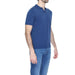 A man in a blue polo shirt from the Diktat - Diktat Men Knitwear collection