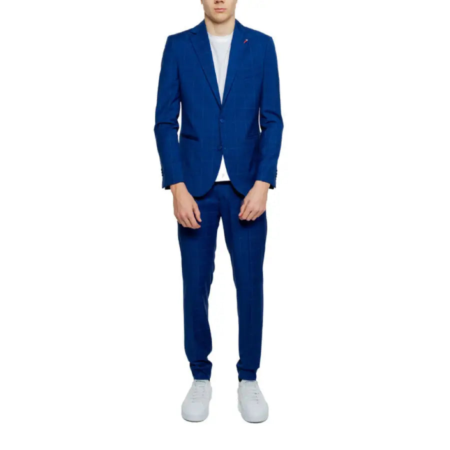 A man wearing a blue Mulish Men Suit - Stylish and elegant men’s formal wear