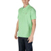 Man wearing a Lacoste Men’s Short Sleeve Green Polo Shirt in light green color