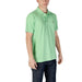 Man wearing a light green Lacoste Men’s Short Sleeve Polo Shirt