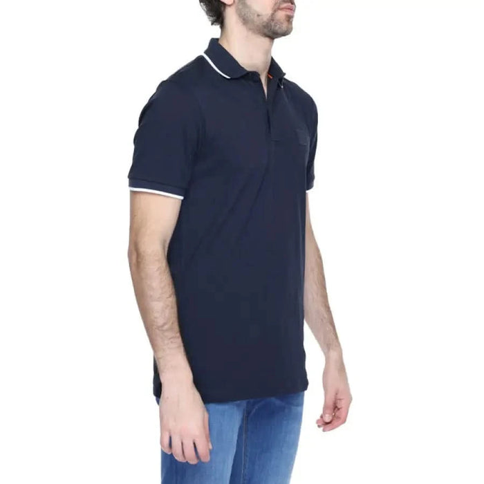 Man wearing Boss Men Polo in navy, showcasing urban city style clothing