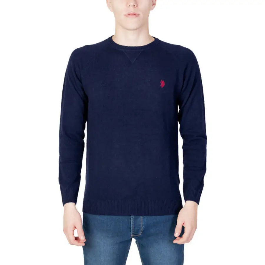 Man wearing a navy sweater by U.s. Polo Assn. from the U.s. Polo Assn. Men Knitwear collection