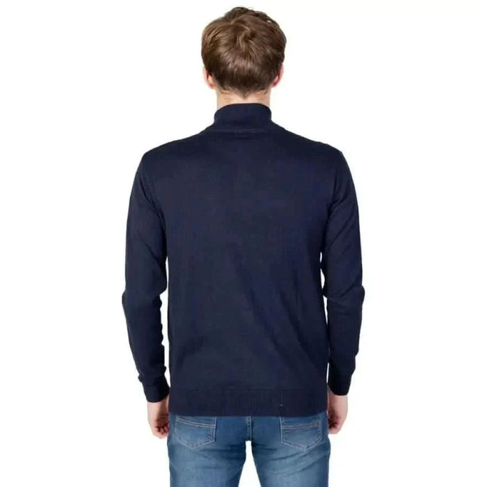 Man wearing a navy sweater jacket from the U.S. Polo Assn. Men Knitwear collection